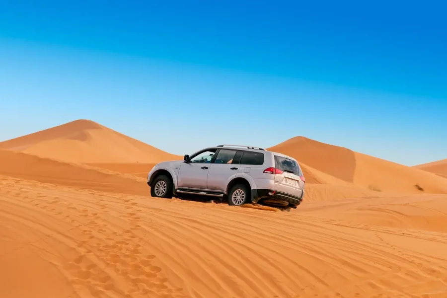 4x4 driving through dunes on a luxury Sahara desert tour from Marrakech