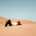 Tourists watching the beauty of on a morocco sahara desert tour