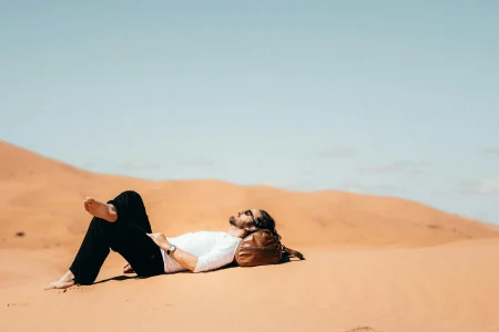 Tourists watching the beauty of on a morocco sahara desert tour