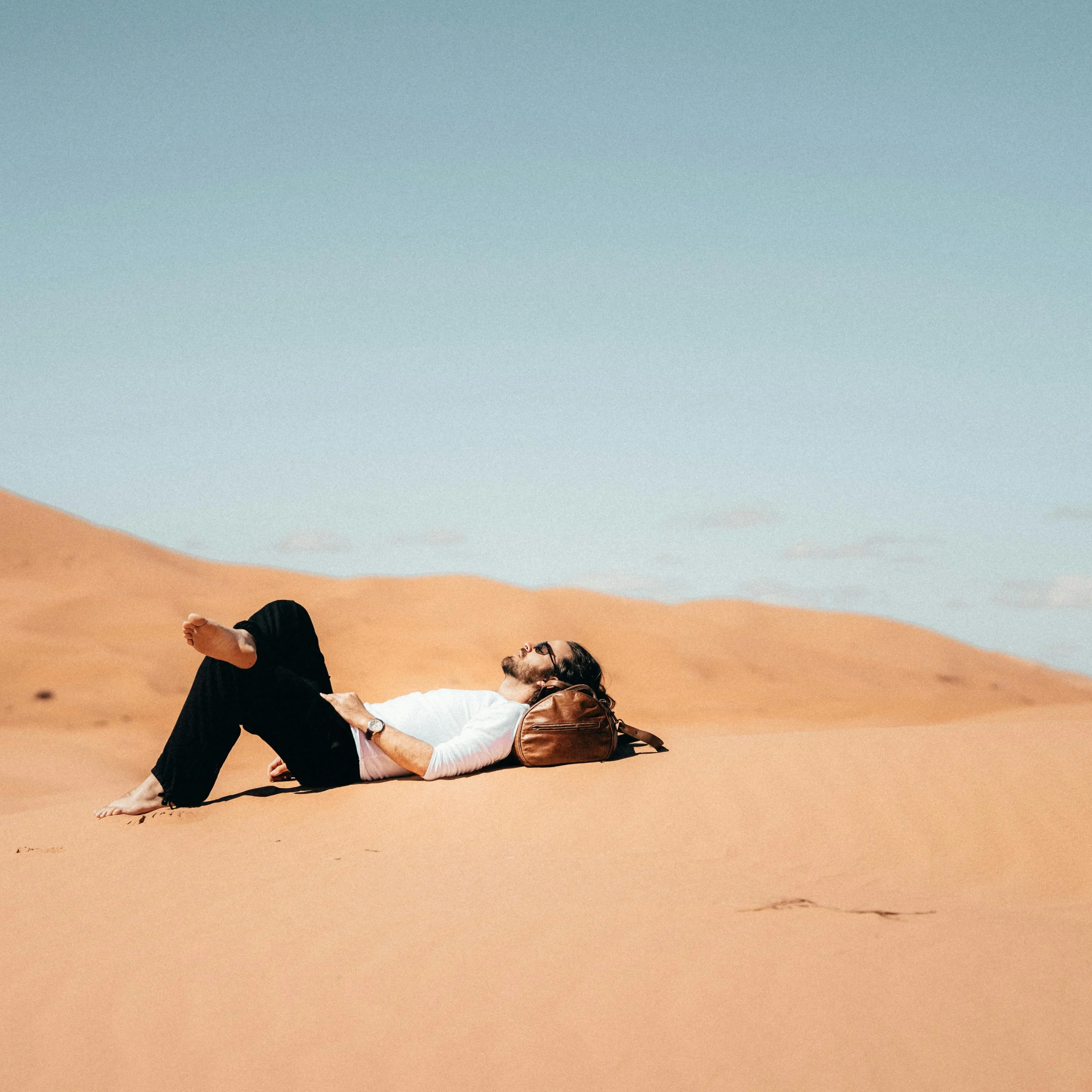 Tourists watching the beauty of on a morocco sahara desert tour