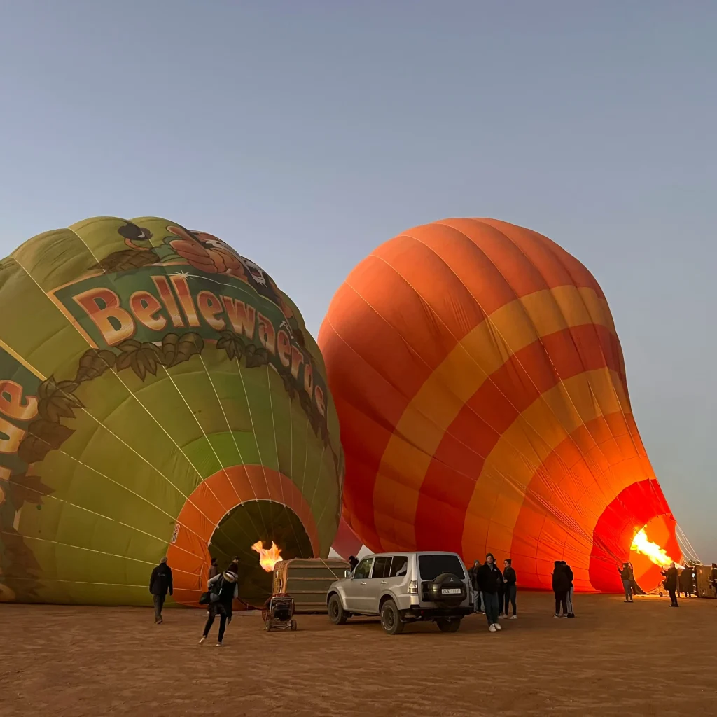 Sahara Welcome team prepping balloon at sunrise