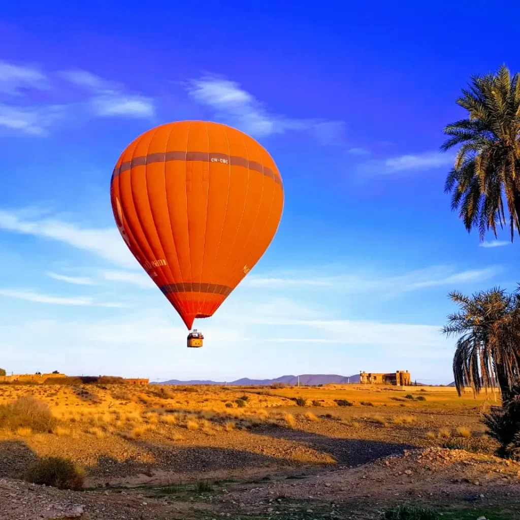 Sunrise balloon over Marrakech rooftops and desert
