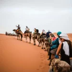 Morocco travel destinations featuring Sahara desert dunes camel trekking